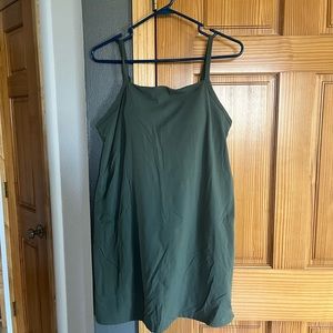 Dress with adjustable strap, built in bra and shorts.